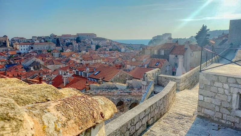 Sunset Wall Walk: 75-Minute Guided Tour & Free Exploration - Revelin and the eastern harbor view